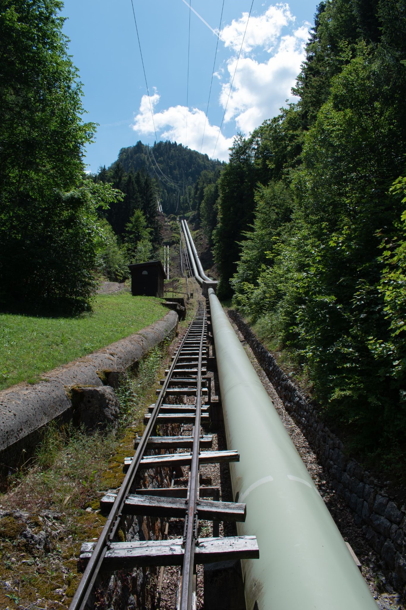 A pipeline with mowed turf alongside it