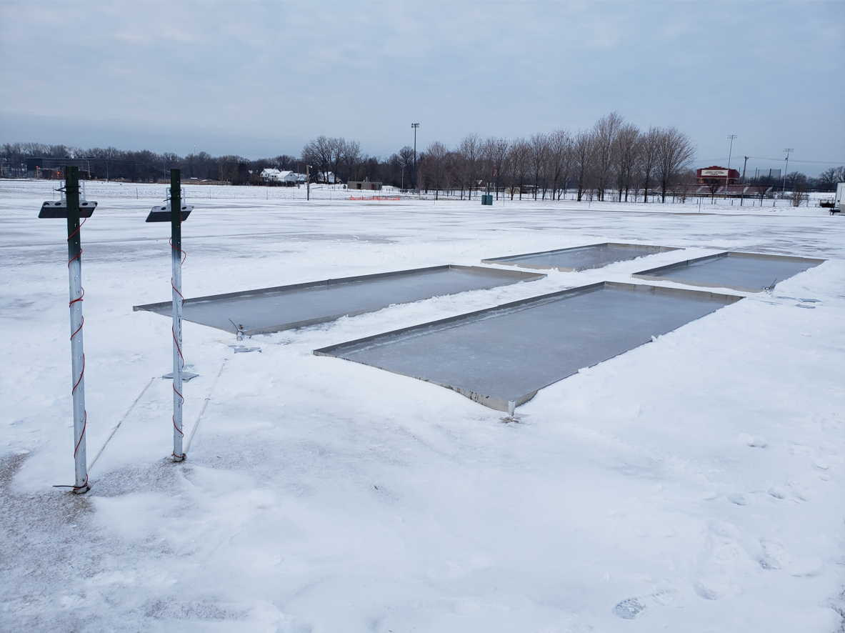 Turfgrass research plots in winter covered with ice