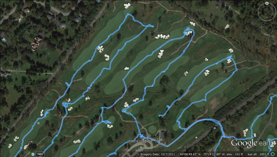 aerial view of a golf course with lines indicating a golfer's path